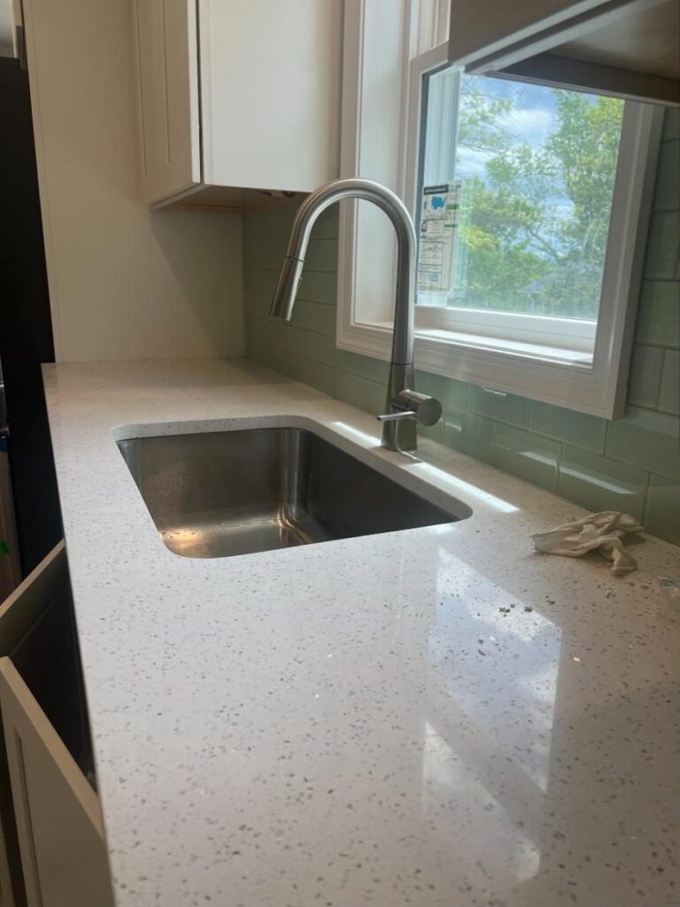 Undermount stainless kitchen sink with pull-down faucet