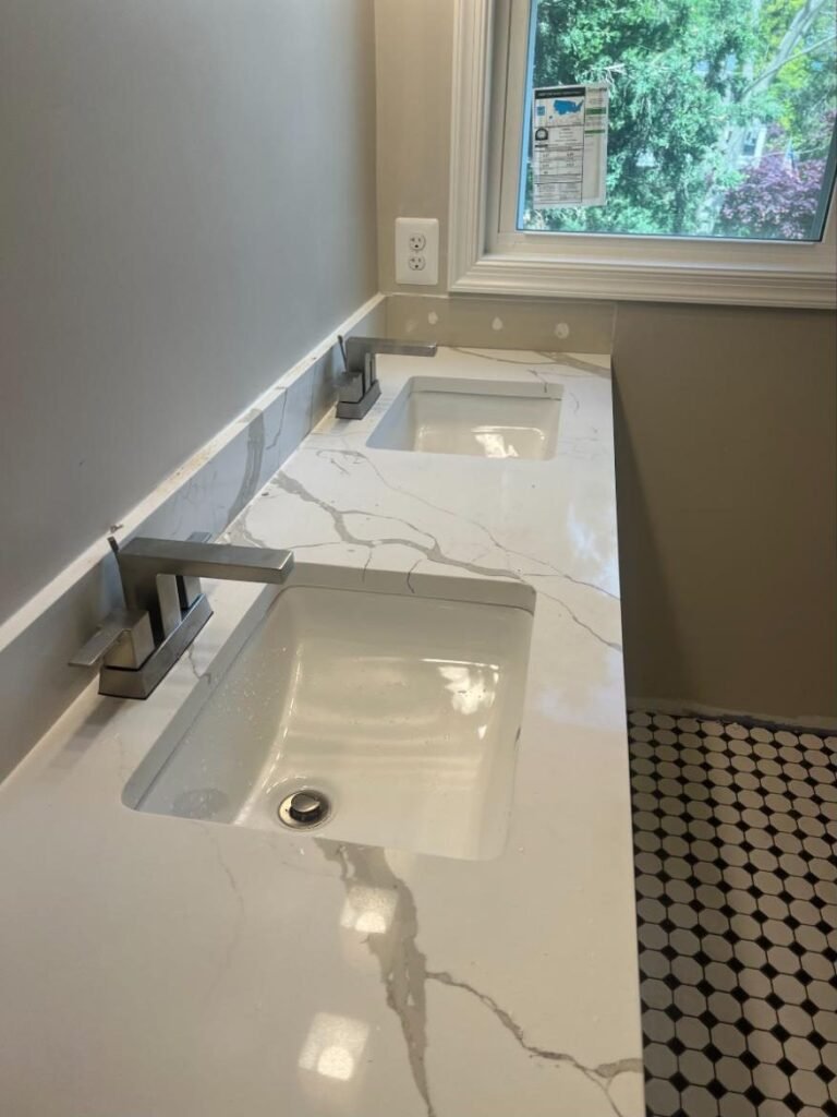 Quartz bathroom vanity with undermount sink and chrome faucet